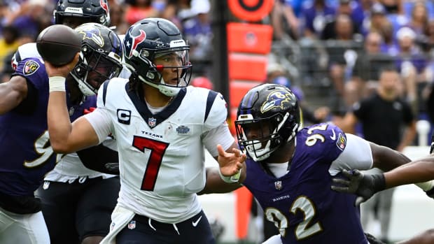 Texans quarterback C.J. Stroud attempts a pass as Baltimore Ravens defensive tackle Rayshad Nichols rushes during the second half at M&T Bank Stadium